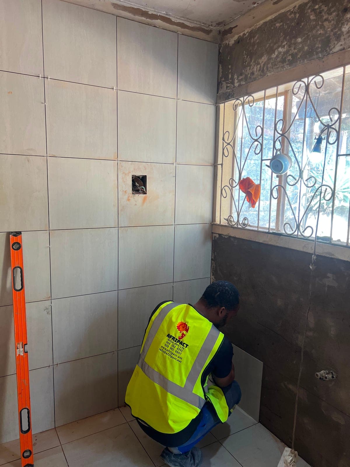 Bathroom renovation in progress, tiling and fixtures